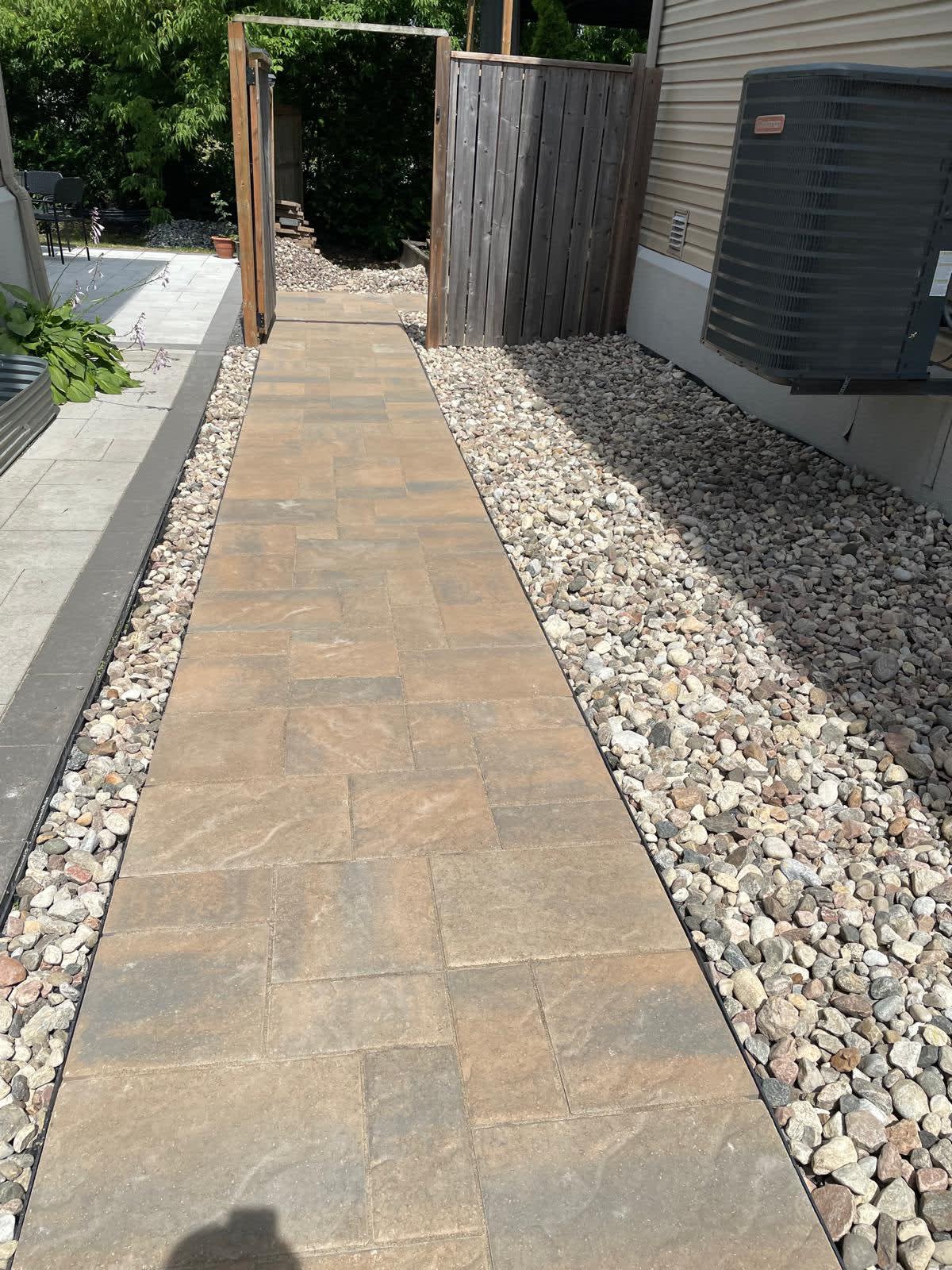 Natural stone garden pathway with gravel borders