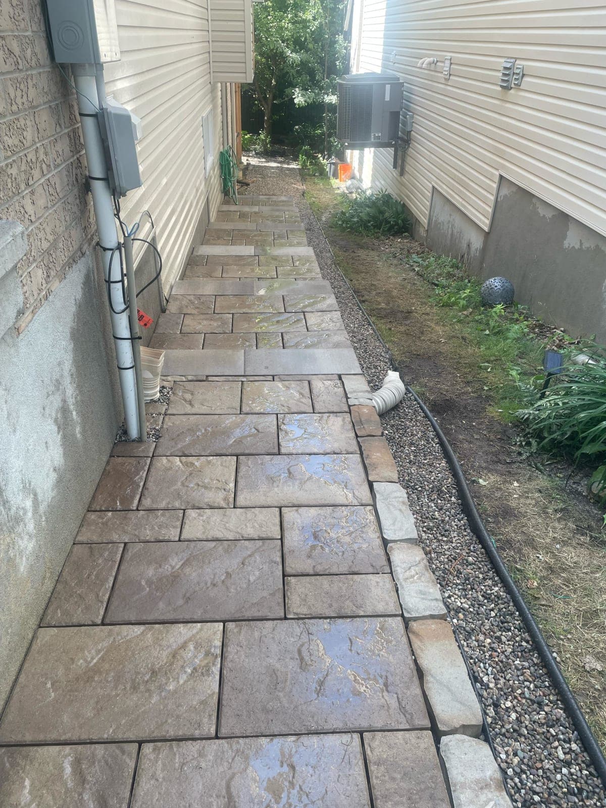 Side yard stone walkway between houses