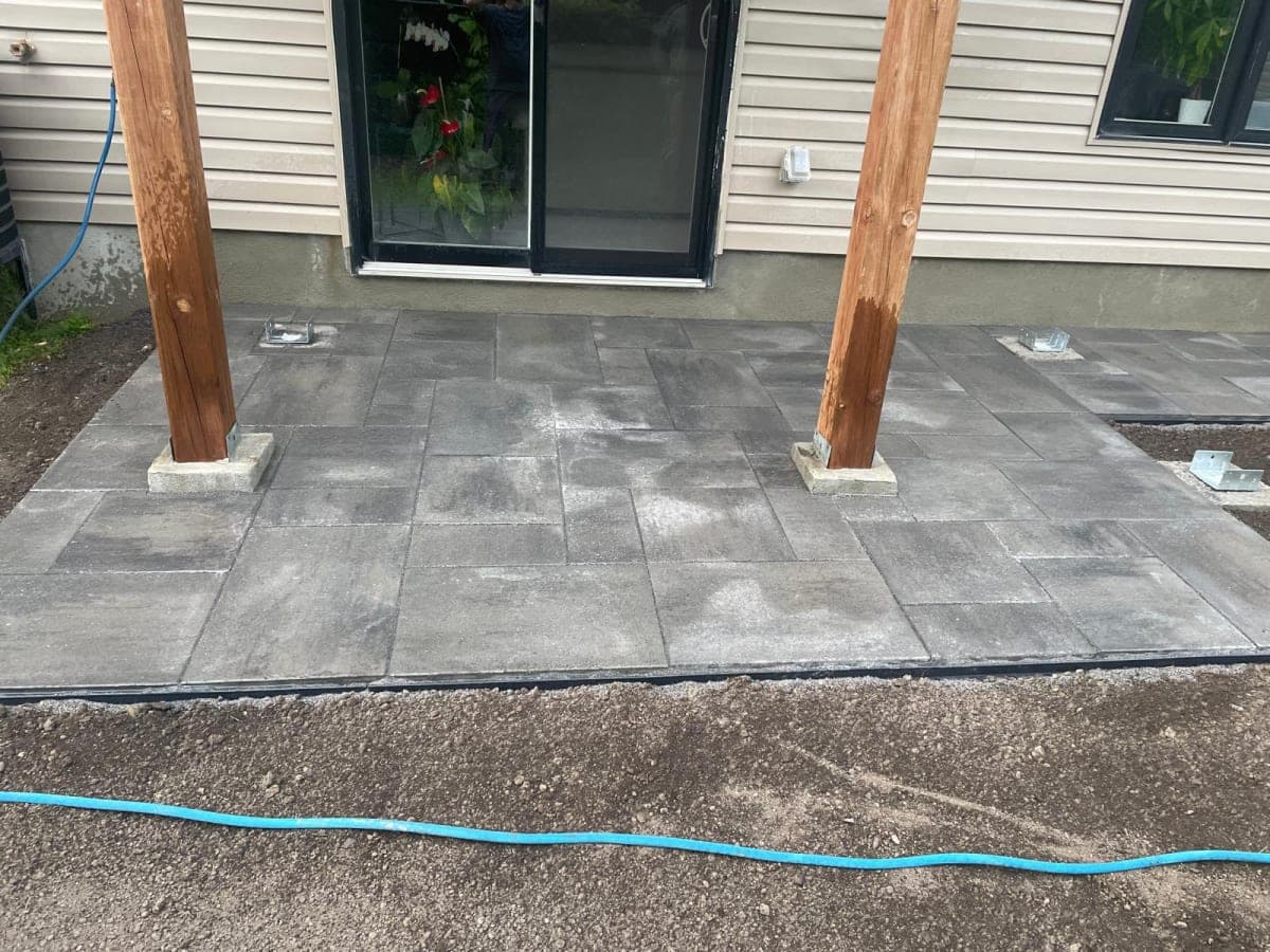 Charcoal interlock patio with pergola posts