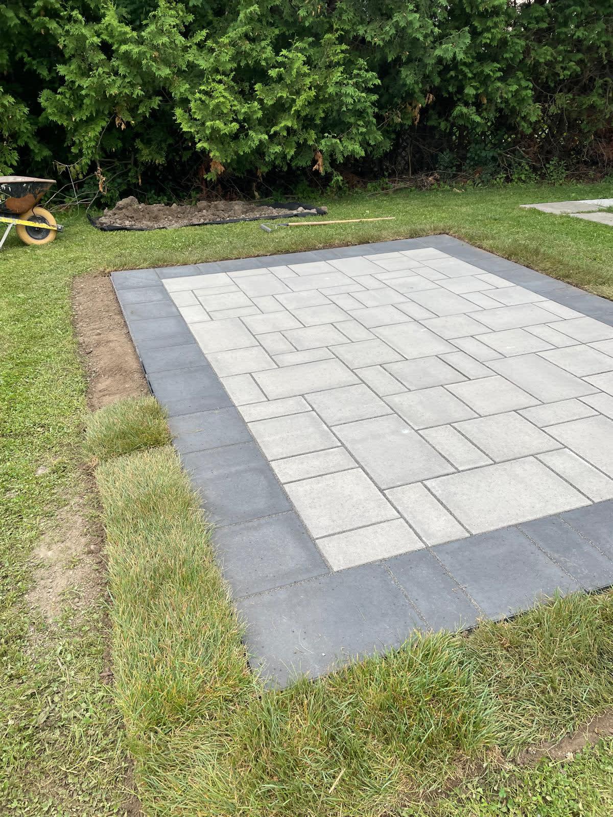 Natural stone retaining wall and landscaping